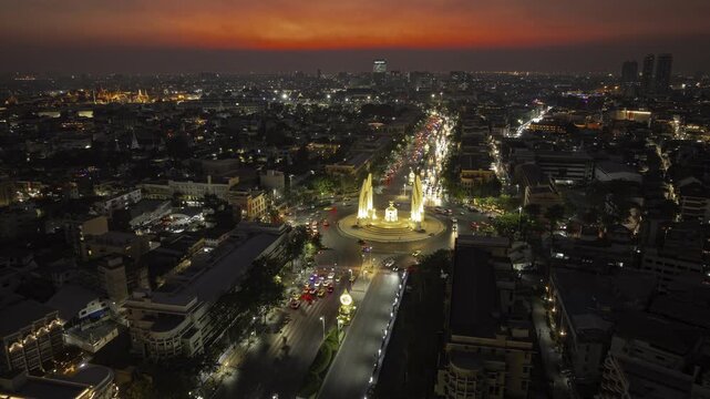 sunset sky night illumination bangkok city traffic street square democracy monument aerial panorama 4k timelapse thailand