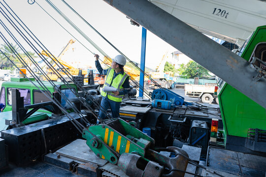 Inspecting crane equipment construction site safety compliance