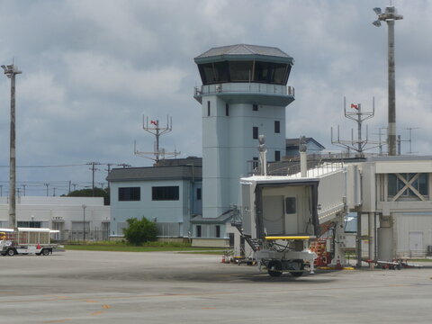 Control Tower and Passenger Boarding Bridge at Miyako Airport, Okinawa, Japan