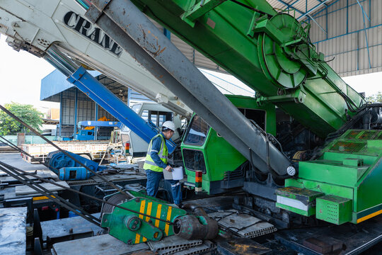 Crane equipment inspection at construction site during safety maintenance