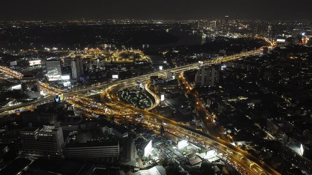 night time illumination bangkok city traffic street road interchange aerial panorama 4k timelapse thailand 
