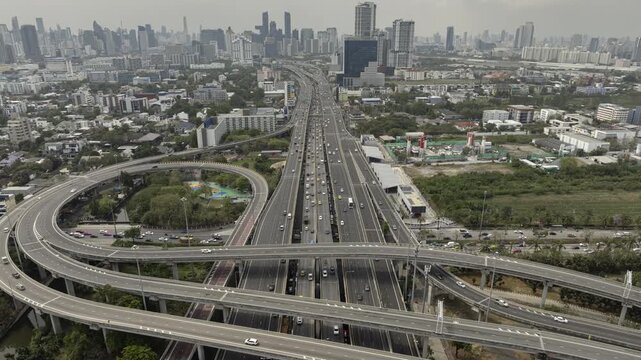 day time flight over bangkok city traffic street road interchange aerial panorama 4k timelapse thailand 