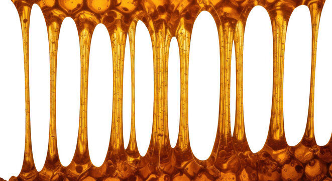 Sticky golden honey flowing in vertical streaks with bubbles, sweet dessert syrup background.
