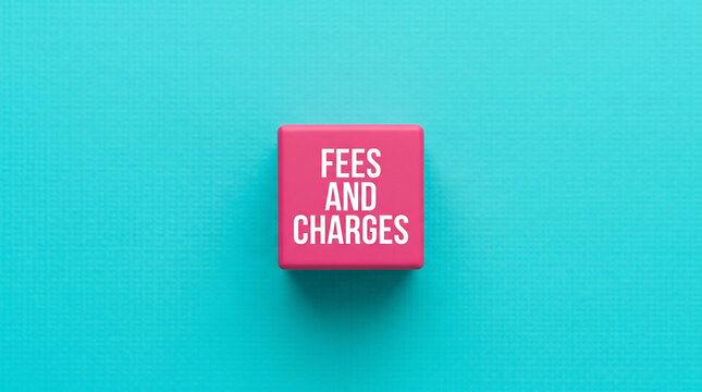 Pink block with fees and charges text, business concept, finance keywords, colorful background