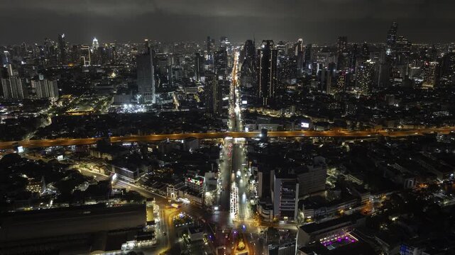 night time illumination bangkok city center traffic street road aerial panorama 4k timelapse thailand  