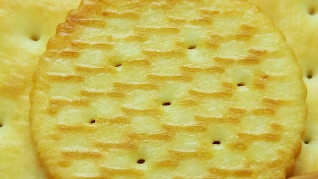Golden round cracker isolated  crispy baked snack for appetizers and healthy eating 