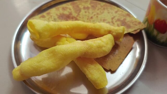 ​Crunchy Indian Fryums Snack with Crispy Khakhra in a Plate