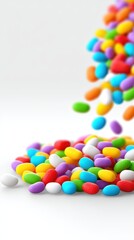 Obraz premium Colorful candy sprinkles falling on a white background