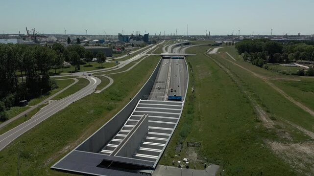 Aerial footage of the southern approach and tunnel entrance of the Blankenburg Tunnel on the Rozenburg side.