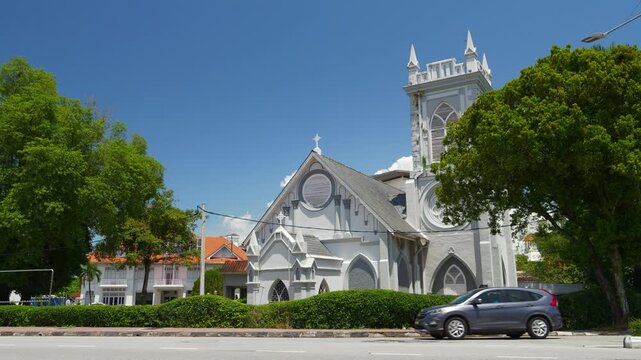 sunny day penang island george town famous church exterior traffic street slow motion panorama 4k malaysia