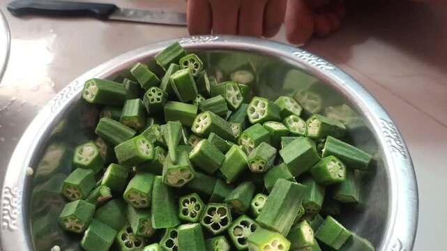 Close Up of Chopped Green Okra Lady Finger Vegetables in a Bowl