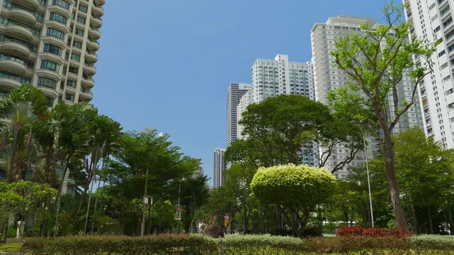 sunny day penang island george town modern apartment buildings area slow motion park panorama 4k malaysia