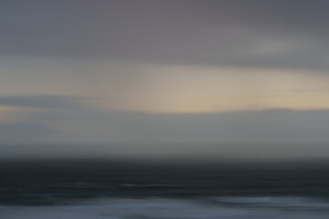 Obraz premium Impressionist coastal dark and moody view to horizon at Ripiro Beach Northland New Zealand.