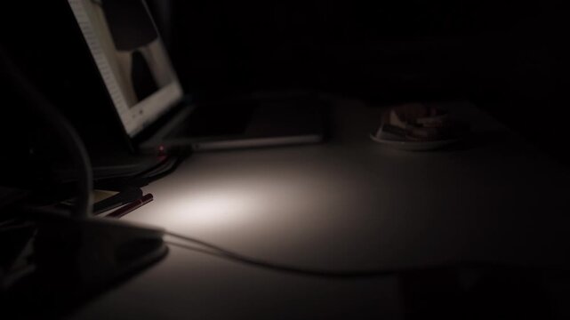 Hand Setting Down Glass of Water in Dark Minimal Scene