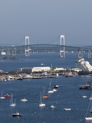 Obraz premium Newport, Rhode Island, USA - aerial view of harbor, sailboats and Claiborne Pell Bridge on a clear day. g.