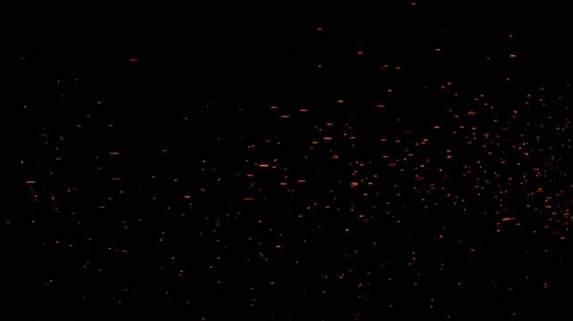 Burning red hot sparks and embers flying against black background creating a fiery particle effect