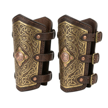 A pair of detailed brown leather bracers with knot patterns.