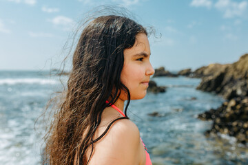Side Profile Portrait of a Young Girl Looking at the Ocean on a Summer Day © Victoria