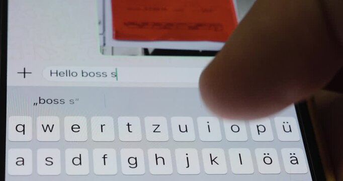 Close-up of a person typing a message on a smartphone to notify an employer about illness and absence from work. Concept of sick leave, workplace communication, and remote notification.