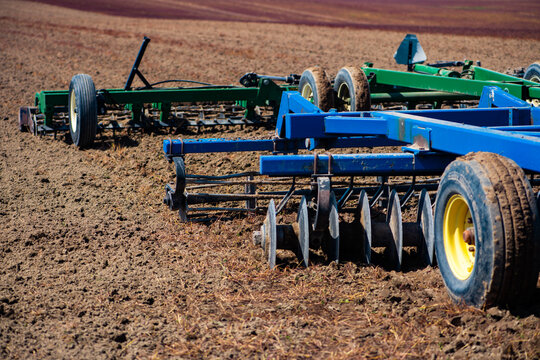 Tillage equipment prepares soil for farming. Heavy tillage supports rural spring fieldwork. Disc blades improve tillage on farmland. Agricultural machinery uses tillage for cultivation.