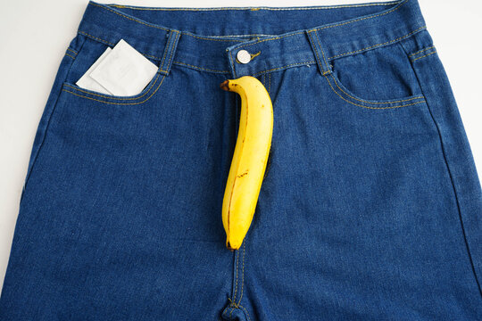 Banana with measuring tape on jean trousers, penis health.