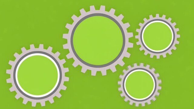 Four Interlocking Gears on Green Background: A set of four interlocking gears, rendered in grey and white, are positioned against a vibrant green background, symbolizing connection, process.