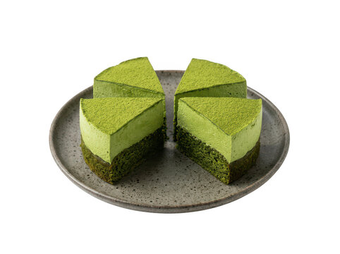 Sliced green matcha cake on a plate isolated on transparent background