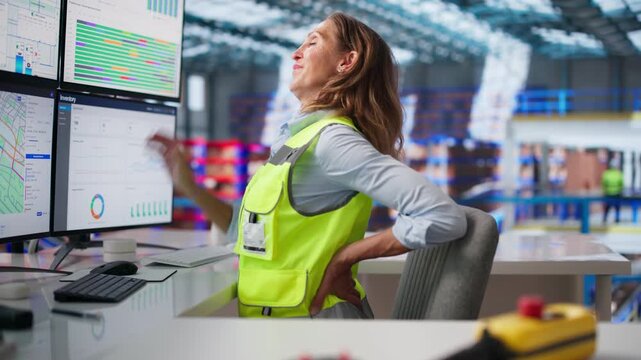 Worker Adjusting Posture To Reduce Back Pain