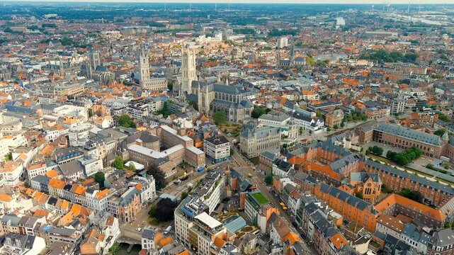 Ghent, Belgium. Cathedral of Saint Bavo. Panorama of the central city from the air. Cloudy weather, summer day. Drone footage, Departure of the camera