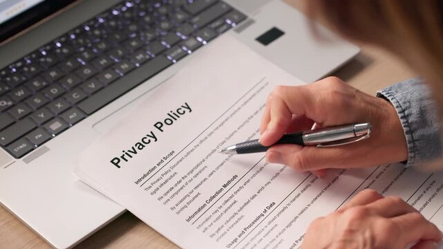 Person Reviewing Important Documents About Privacy Policy