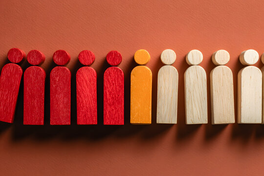 Human wooden dominoes falling in row representing global financial crisis, domino effect contagion, virus pandemic disease spread, business bankruptcy chain, and crisis management.