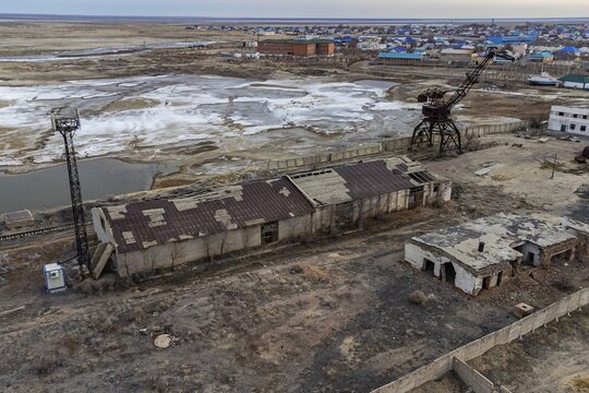 Aerial of the Aral lake and Aralsk, with its rusty cranes, Aral lake, Kazakhstan