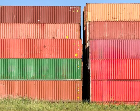 View of stacked colorful shipping containers in an industrial port area under a clear blue sky Avcilar, Istanbul, Turkey.