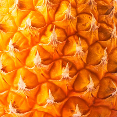 Fototapeta premium Macro texture of fresh ripe pineapple skin. Close up tropical fruit peel abstract pattern. Summer detox ingredient backdrop.