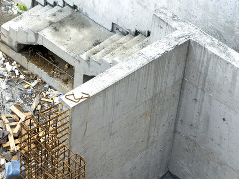 View of a construction site featuring reinforced concrete walls, stairs, and steel rebar cages in Sariyer, Istanbul, Turkiye.