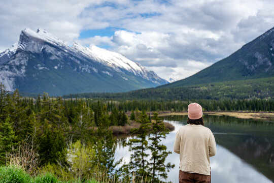Woman viewing Vermillion Lakes and Mount Rundle in Banff National Park