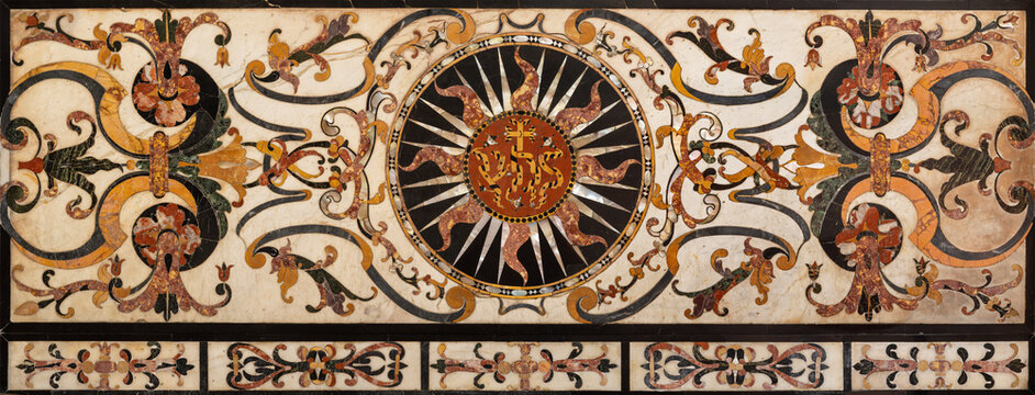 Pistoia - The IHS initials in the stone floral mosaic (Pietra dura style) iin the Cathedral of San Zeno by unknown artist.
