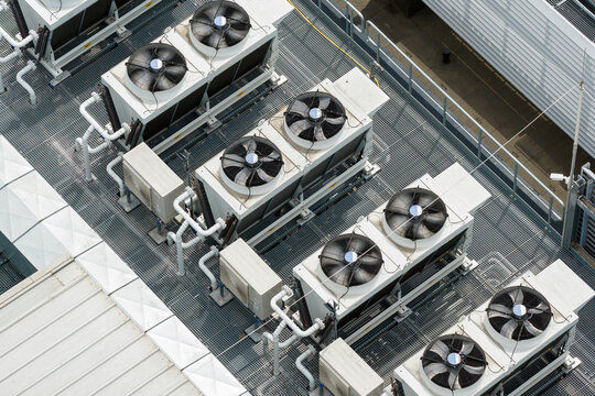 Aerial view of industrial HVAC cooling units and ventilation fans on the rooftop of the AI datacenter in Warsaw, Mazowieckie, Poland.