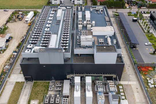 Aerial view of the cloud compute datacenter facility with rows of HVAC and ventilation units on the roof in Warsaw, Mazowieckie, Poland.