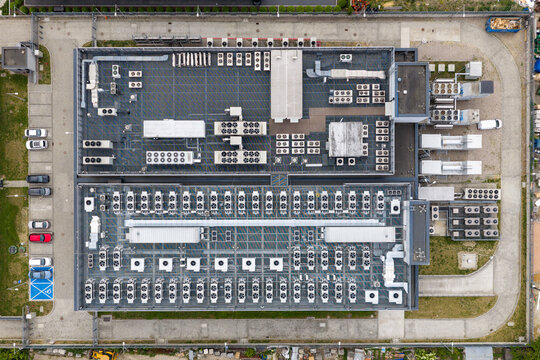 Aerial view of the AI datacenter building with rows of cooling units and ventilation systems on the roof Warsaw, Masovian Voivodeship, Poland.