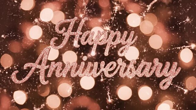 Sparkling 'Happy Anniversary' text overlayed on a bokeh background of warm, glowing lights, creating a festive and celebratory atmosphere.