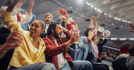 Naklejka premium Black Woman in Yellow and a White Man With Red Face Paint Join Diverse Soccer Football Supporters in Stadium, Yelling, Lifting Hands, Drinking Beverage, Beating Drums. Fun Authentic Style