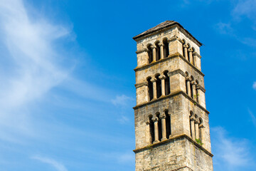 Obraz premium Low angle view of historical St Luke bell tower and medieval church stone walls in Jajce, Bosnia and Herzegovina