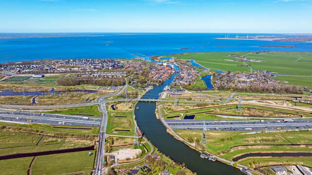 Aerial view of Aquaduct Vechtzicht with highway A1 and in the background the historic town of Muiden in the Netherlands