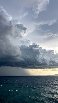 Dramatic stormy weather over ocean waves.