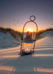romantic lantern with candle on the beach in sunset light © Jenny Sturm