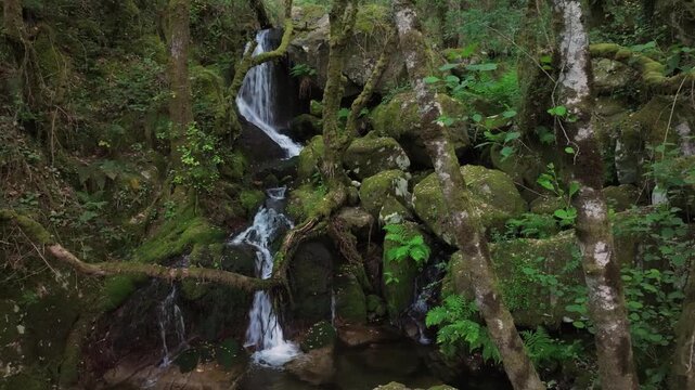 Santo Estevo do Ermo Waterfalls In Tropical Forest In Barreiros, Galicia, Spain. Sideways Shot
