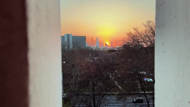 Sunrise over Tashkent city skyline viewed from balcony