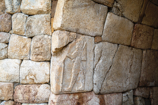 Interior view of the vaulted stone Chamber 2 (Hieroglyph Chamber) at the Southern Citadel of Hattusa. The stone walls feature low-relief carvings of King Suppiluliuma II and extensive Luwian hieroglyp