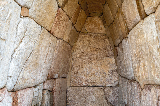 Interior view of the vaulted stone Chamber 2 (Hieroglyph Chamber) at the Southern Citadel of Hattusa. The stone walls feature low-relief carvings of King Suppiluliuma II and extensive Luwian hieroglyp